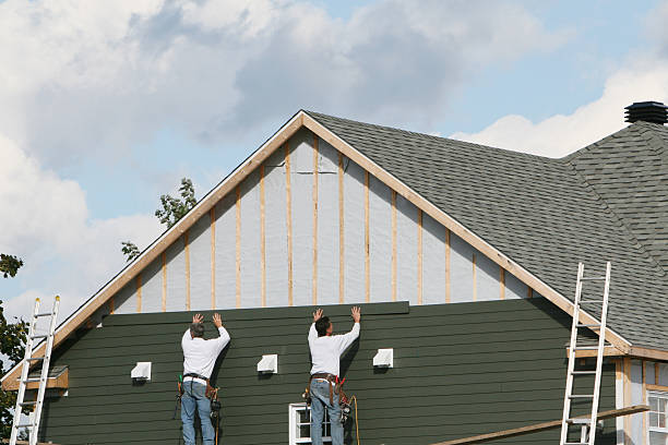 Professional Storm Damage Siding Repair technician working in Girard, IL